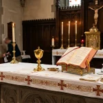 Catholic Church Altar with Golden Chalice and Open Lectionary for Sacred Sacraments